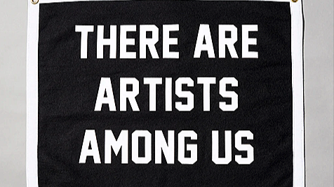 Banner with white text on a black background that reads, "There are artists among us."