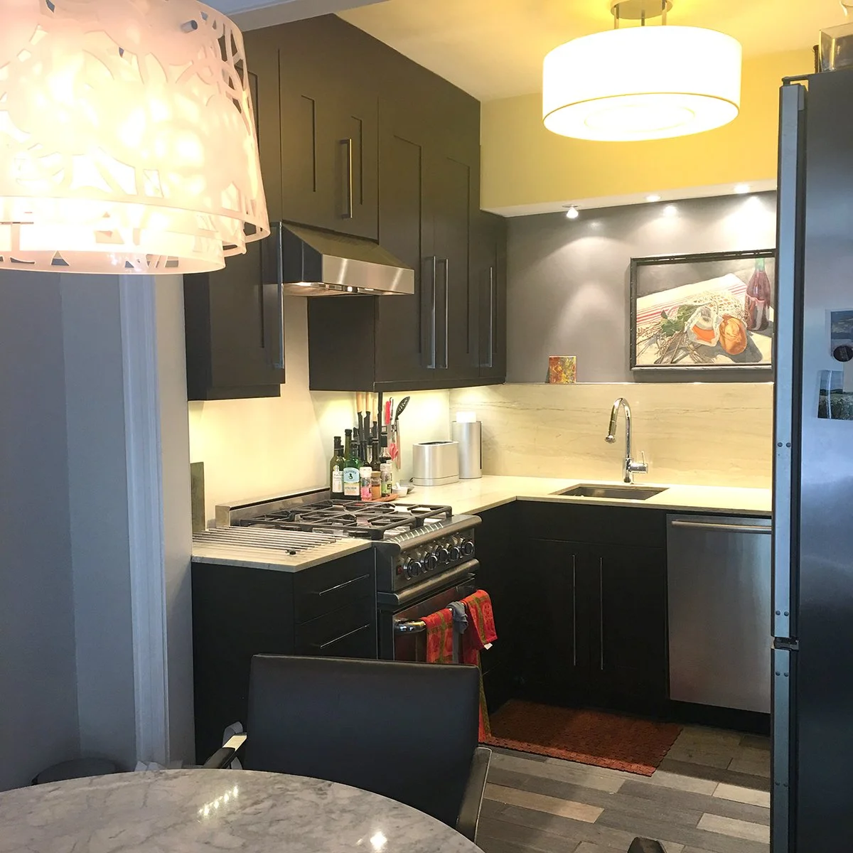 small kitchen with black cupboards