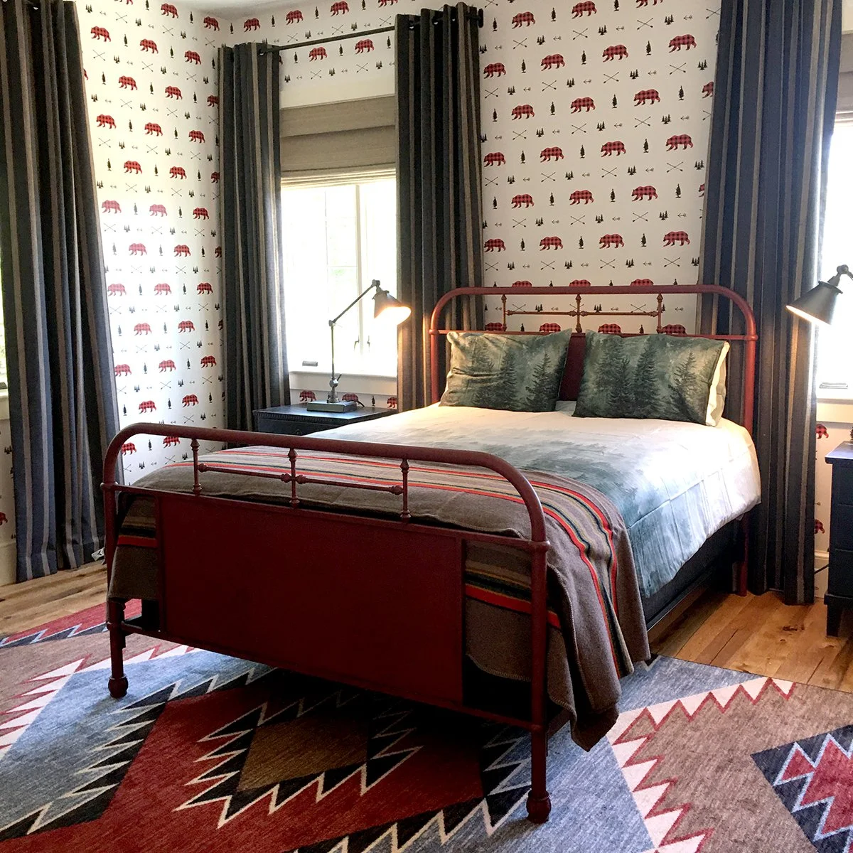 Farm house bedroom, red iron bed, bear print wallpaper