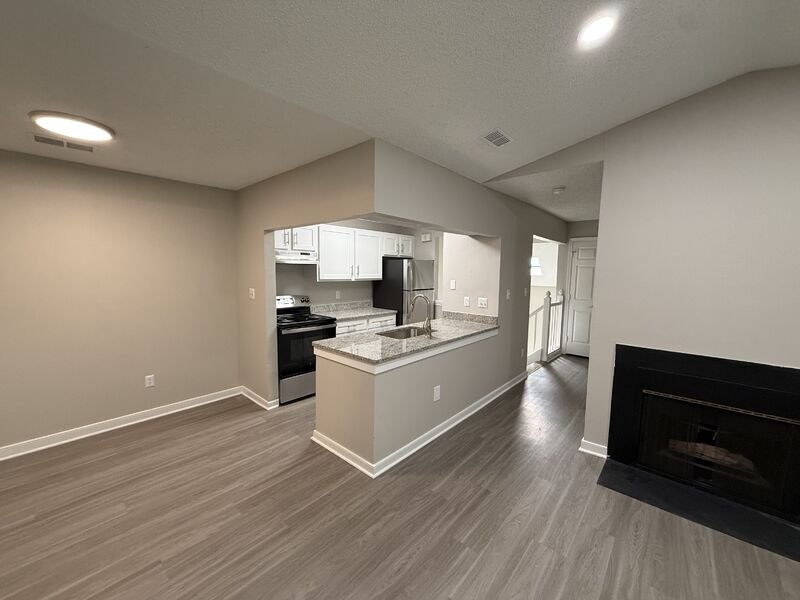Completed apartment living room and kitchen renovation at Attain at Rockwood