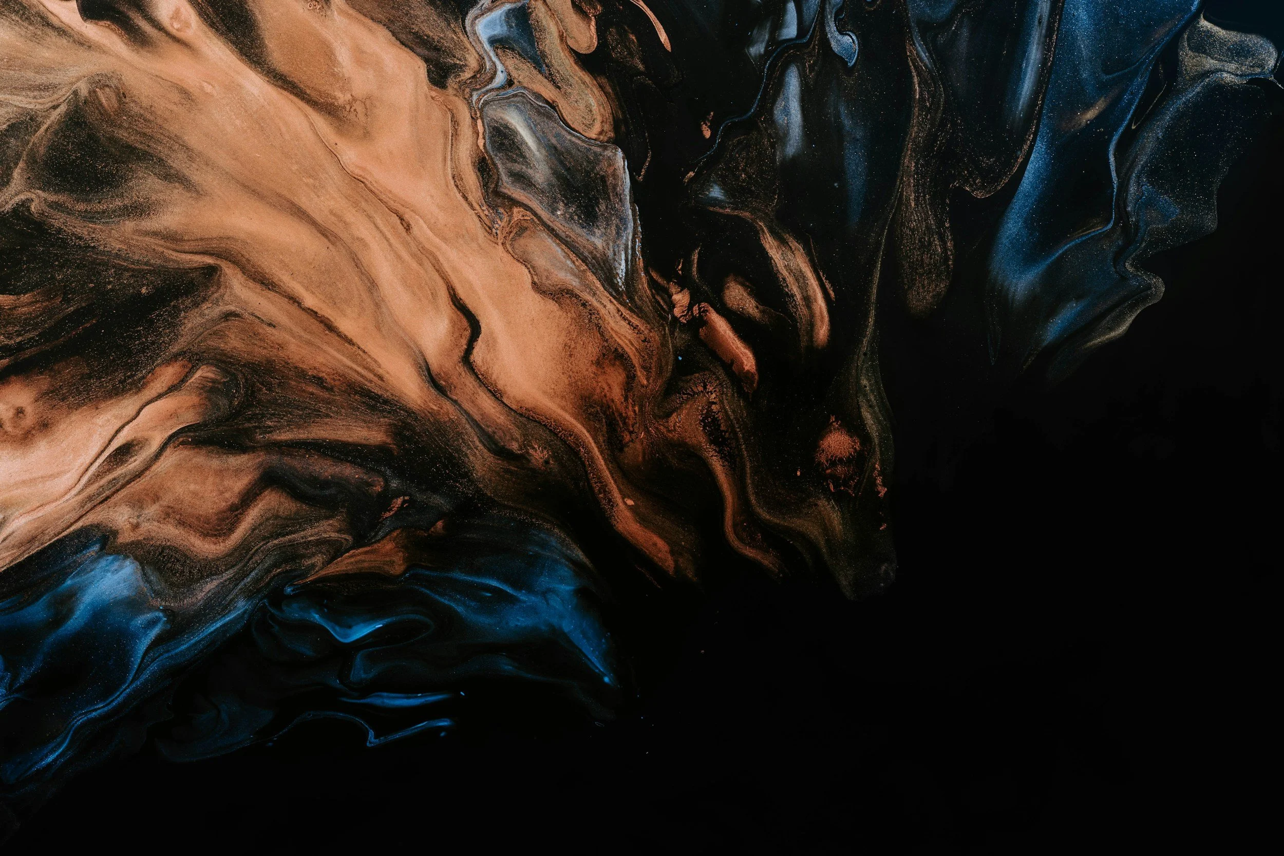 Abstract swirl of black, blue, and copper paint with marbled textures and flowing patterns.