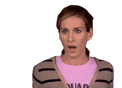 A woman with short brown hair wearing a pink shirt and a striped cardigan, expressing surprise or shock.