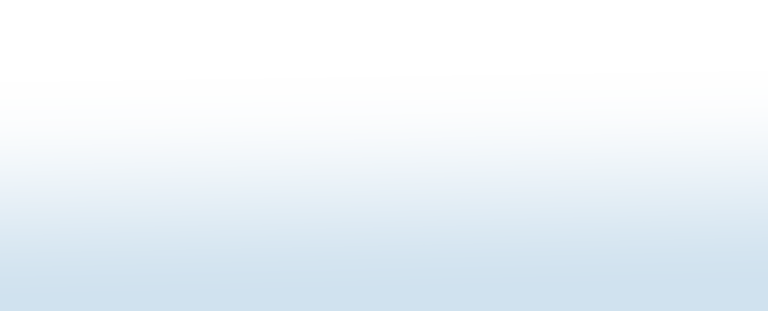 A photograph of a delightful sunset, with a vibrant orange and pink sky reflecting over calm water, overlooking mountains in the distance.