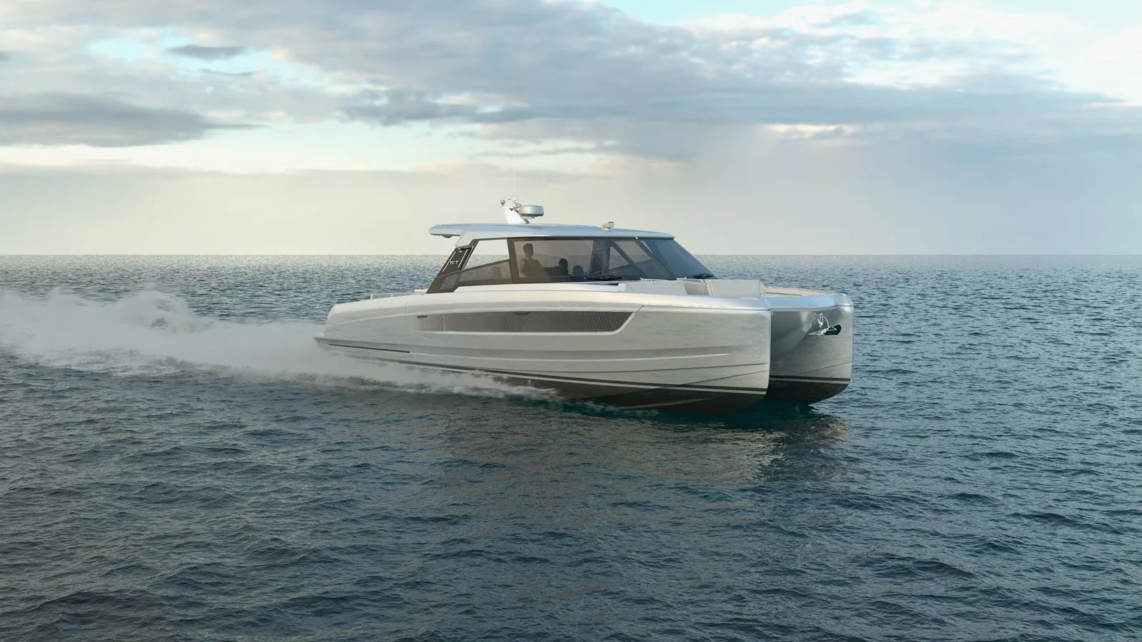 A modern white yacht sailing on open water under a partly cloudy sky.