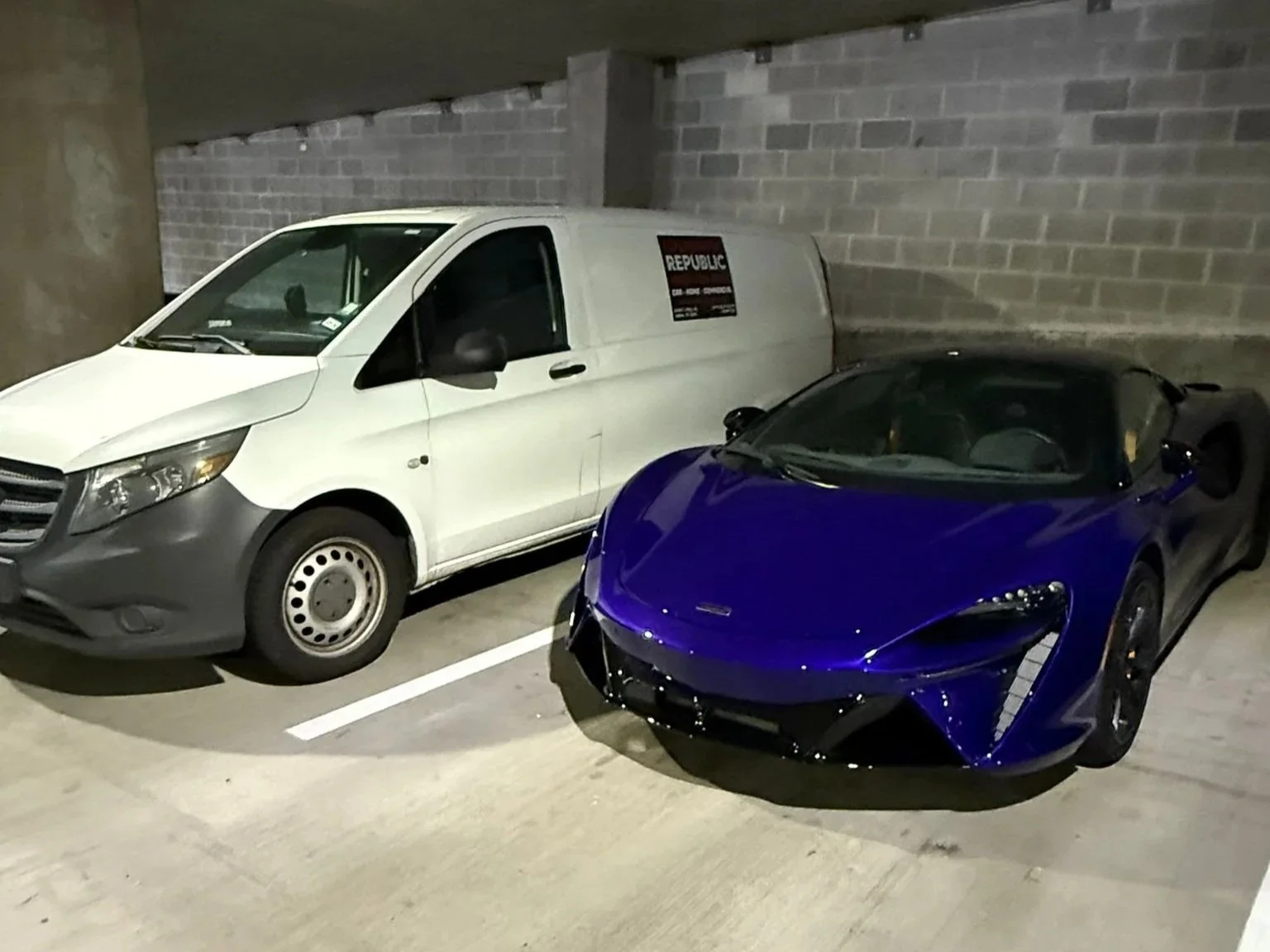 Republic Locksmith mobile service van parked next to a customer's vehicle during an automotive locksmith service in Dallas, TX