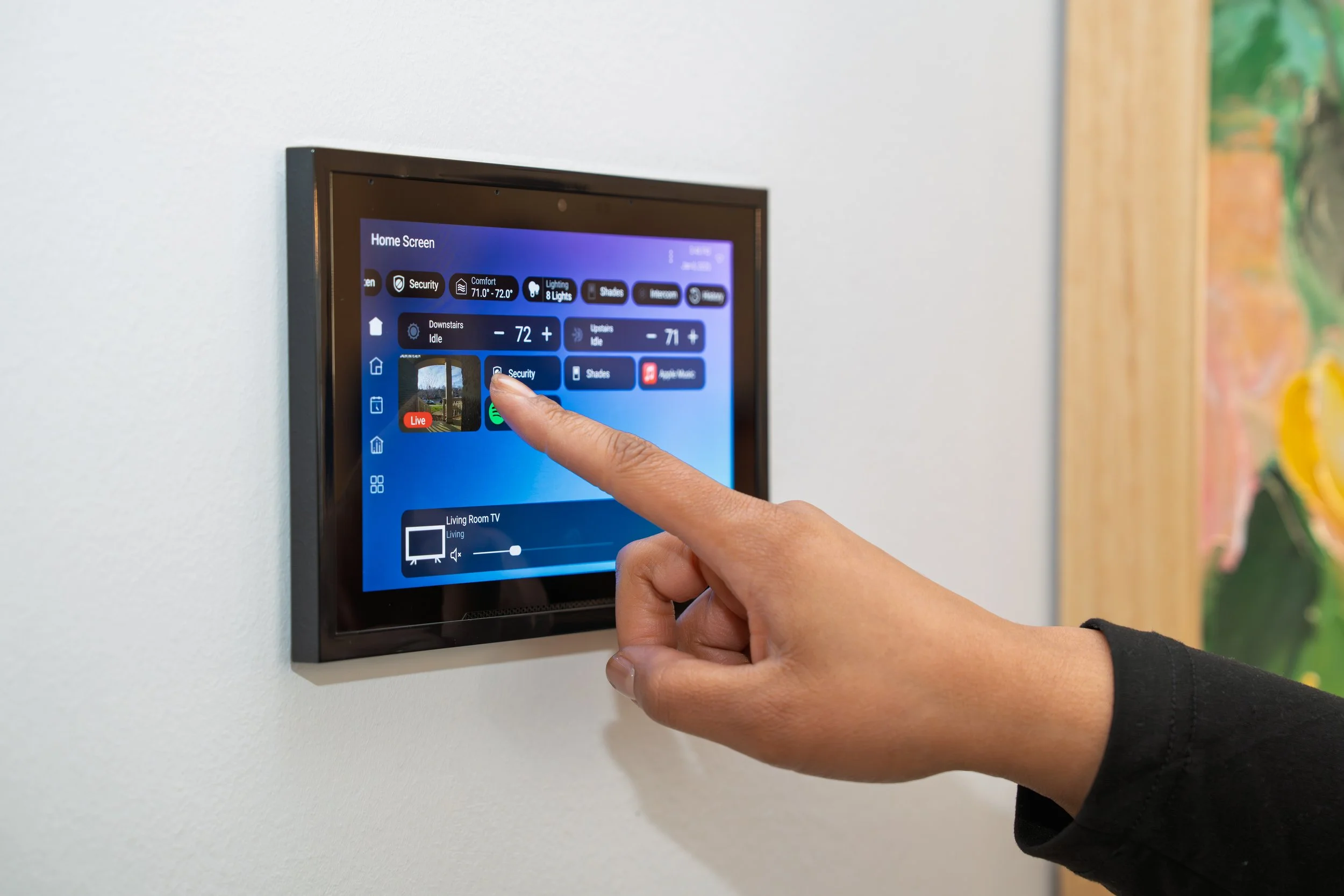 Wall-mounted touchscreen controlling a smart home system