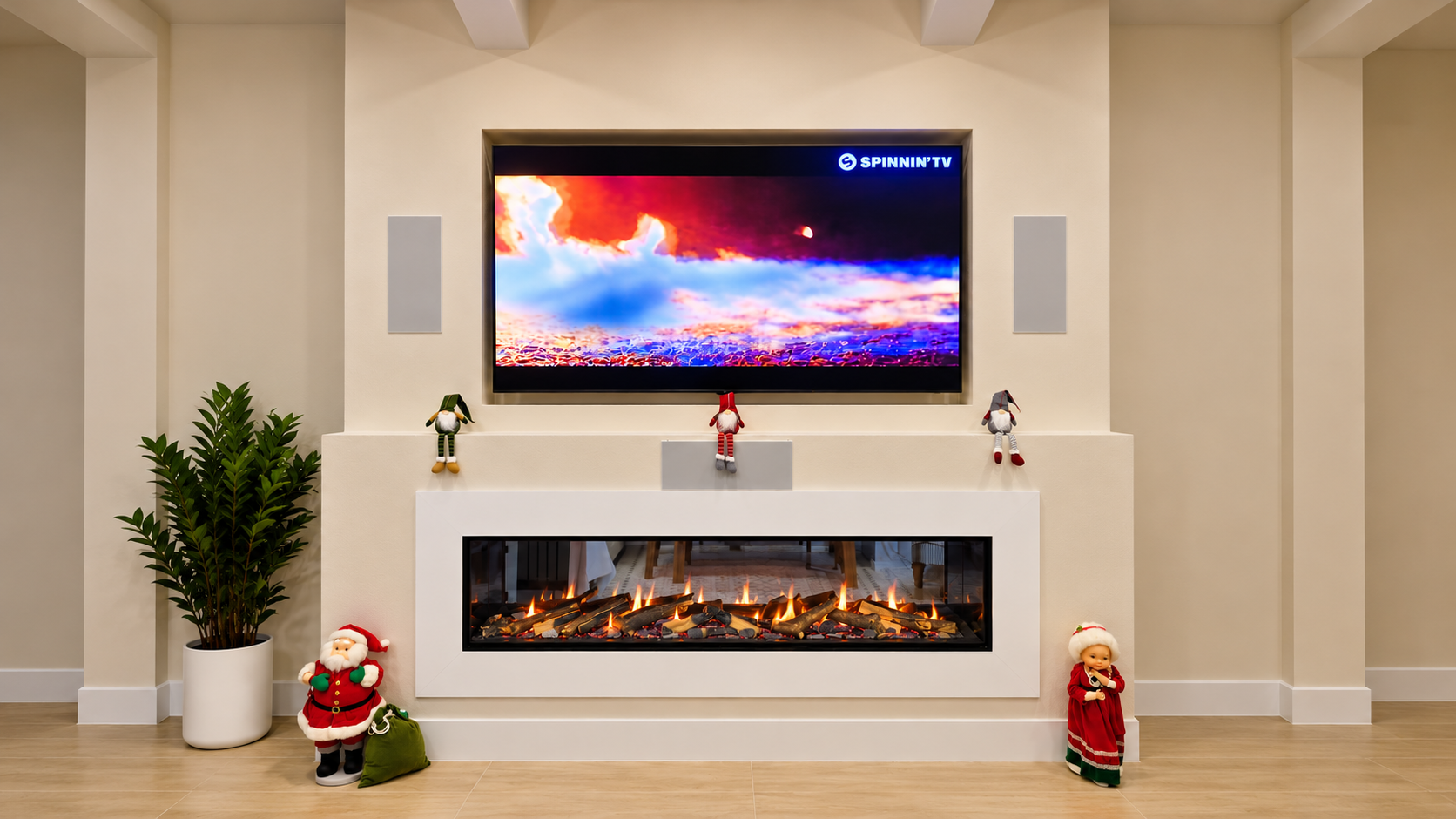 Custom recessed TV installation with in-wall speakers above a modern fireplace in Apollo Beach, FL, by Precision Smart Home.