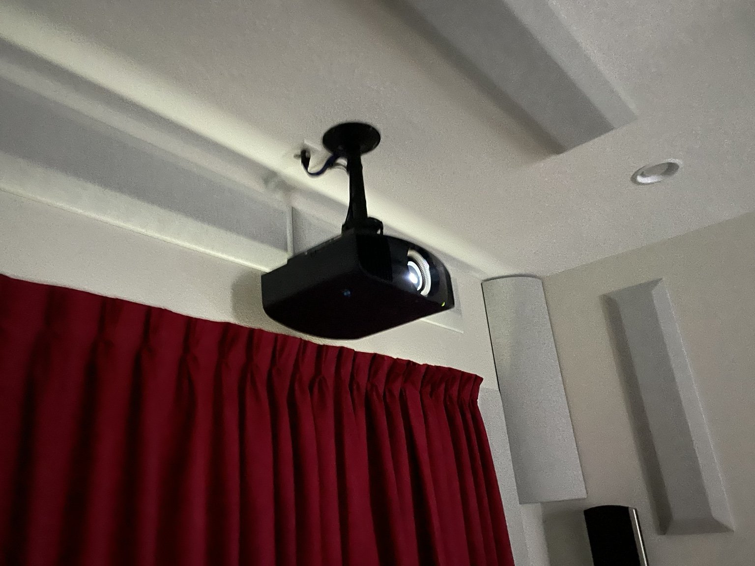 Ceiling-mounted projector installed for a dedicated home theater in Land O’ Lakes, Florida.