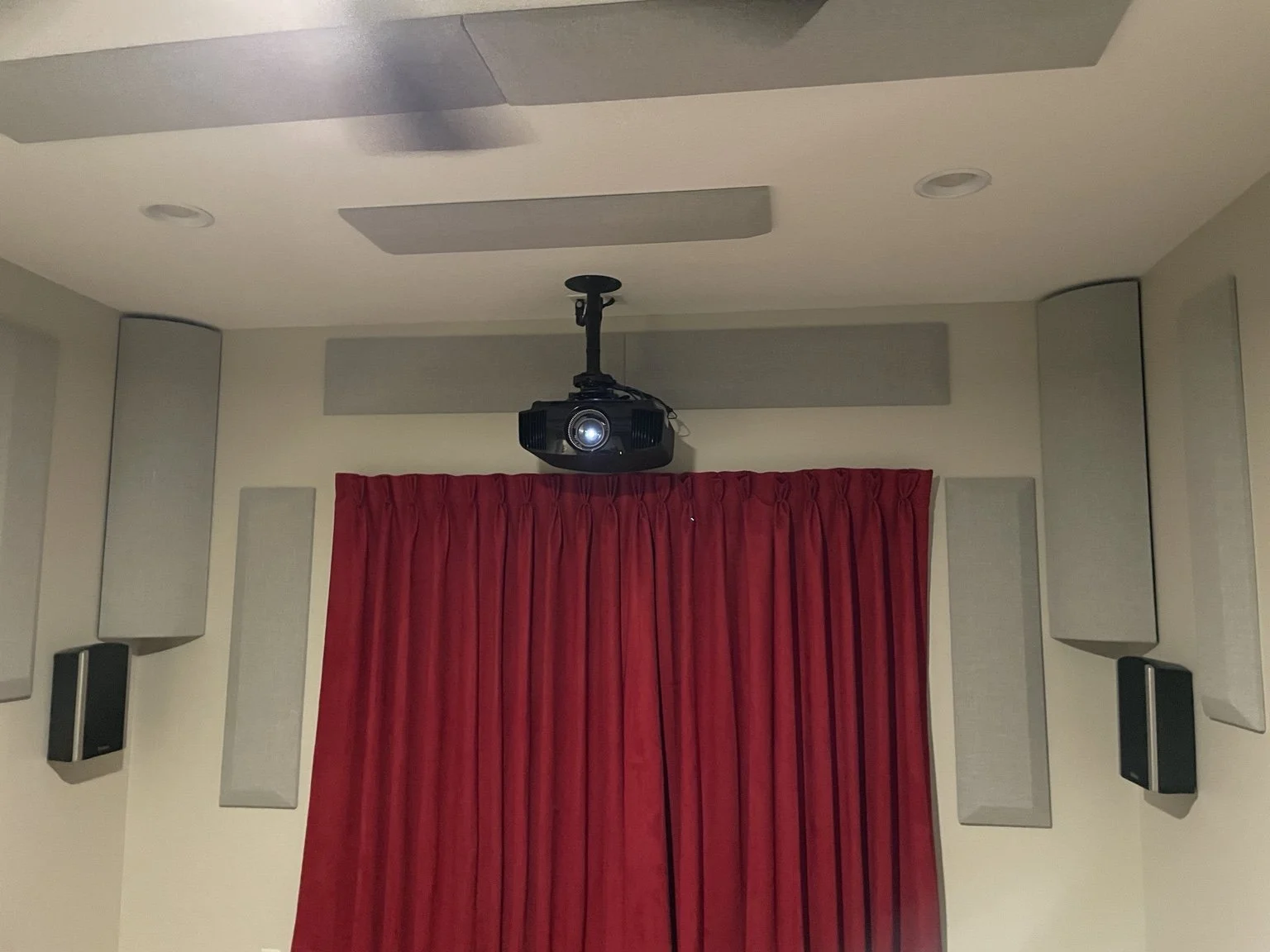 Surround speakers and acoustic treatments installed throughout a dedicated home theater in Land O’ Lakes, Florida.
