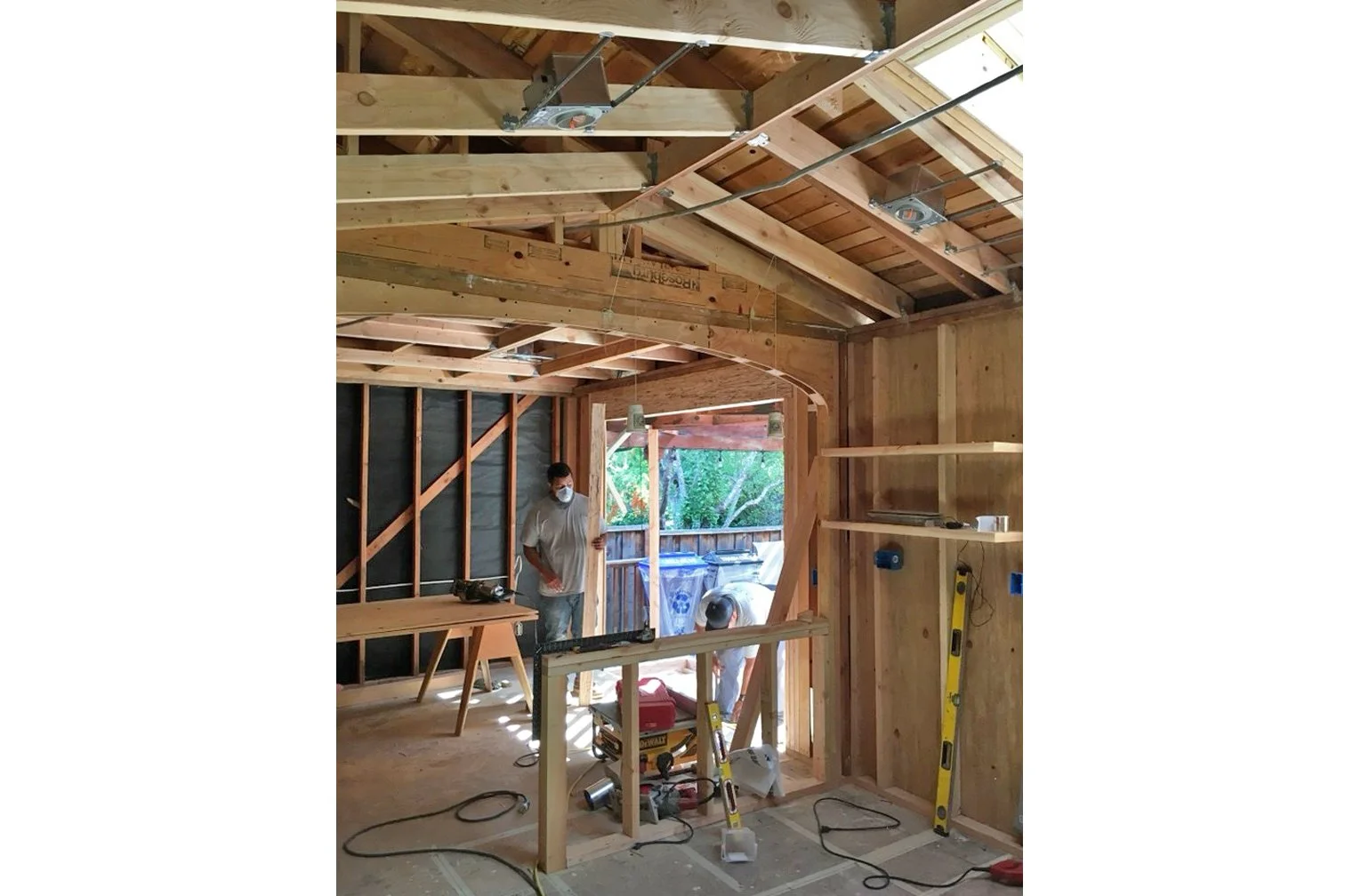 Framing stage of Danville kitchen remodel showing new archway structure and open connection between kitchen and dining areas.