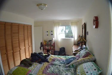 Existing primary bedroom before renovation with standard ceiling height and limited storage, showing the starting point for the Lighthearted home remodel.