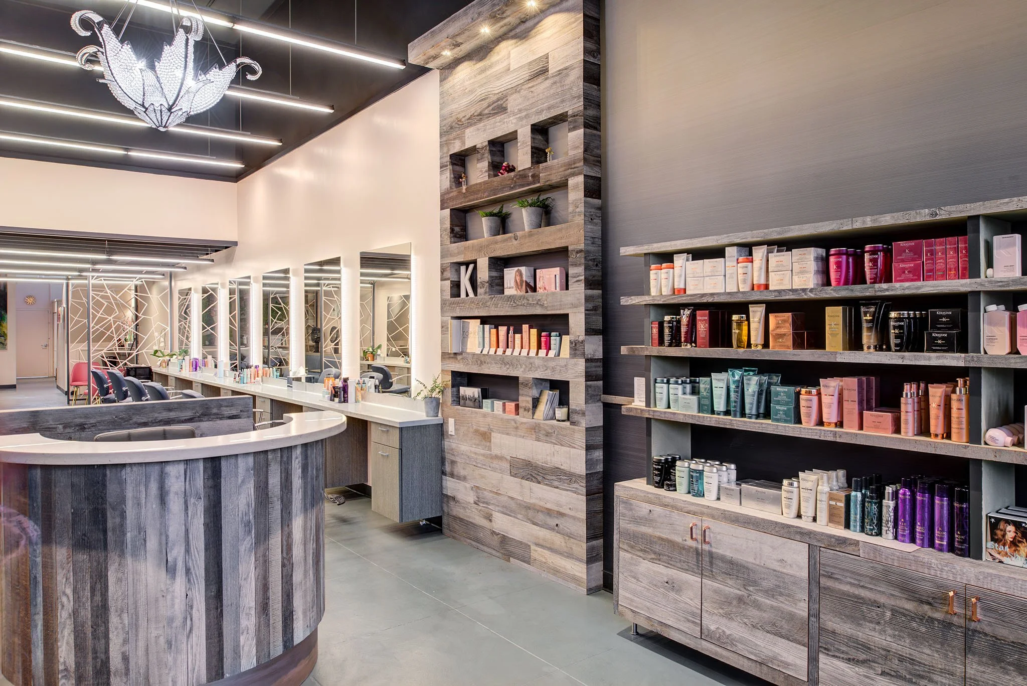Reception and styling area, including retail display shelving of BIBO Salon interior.