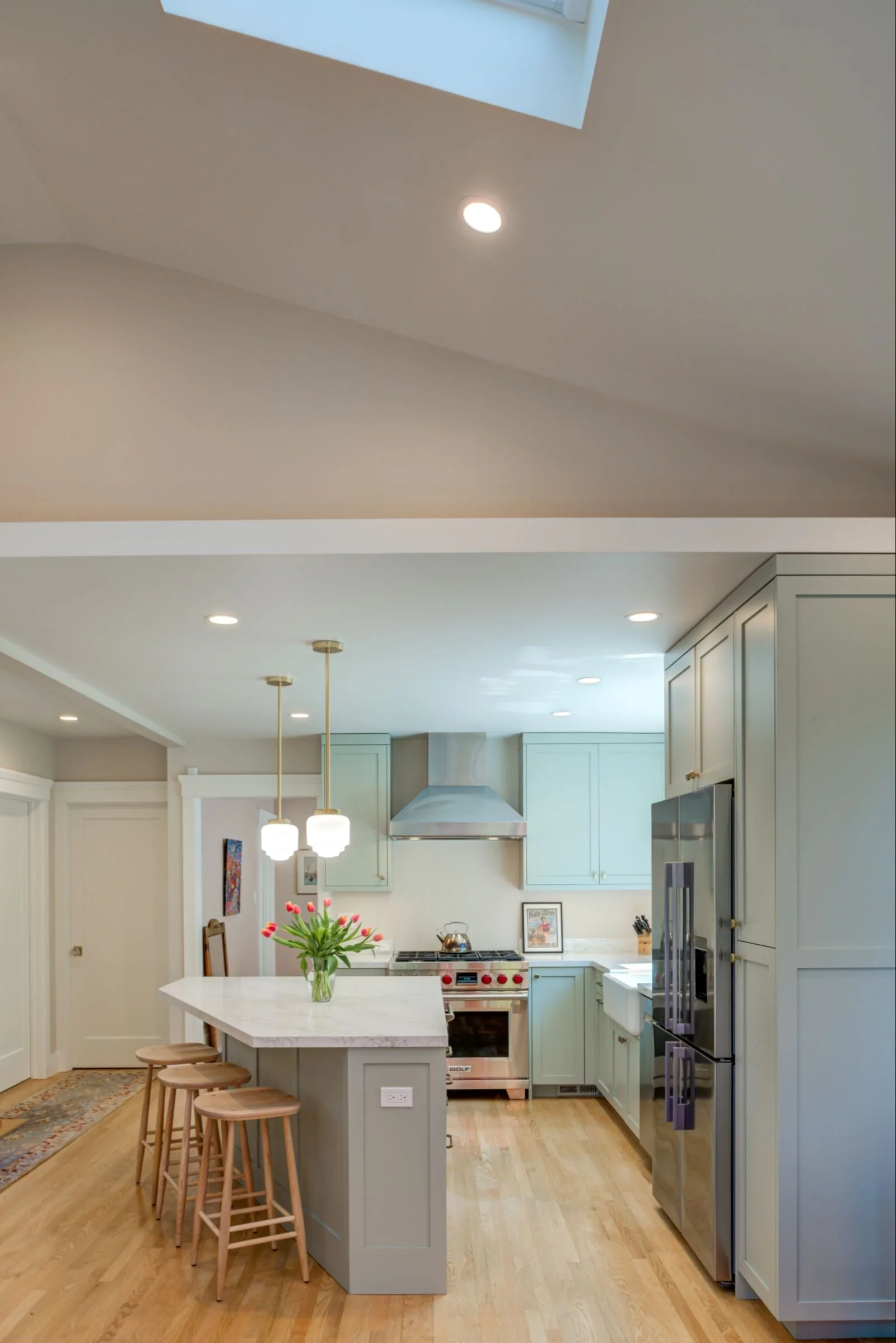 Looking from the Family Room with skylit cathedral ceiling toward the Kitchen. 