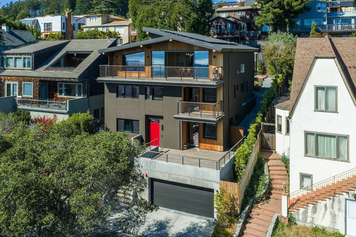 Modern new home in Berkeley, featuring three balconied stories of living space including a JADU, with a 2-car garage at street level