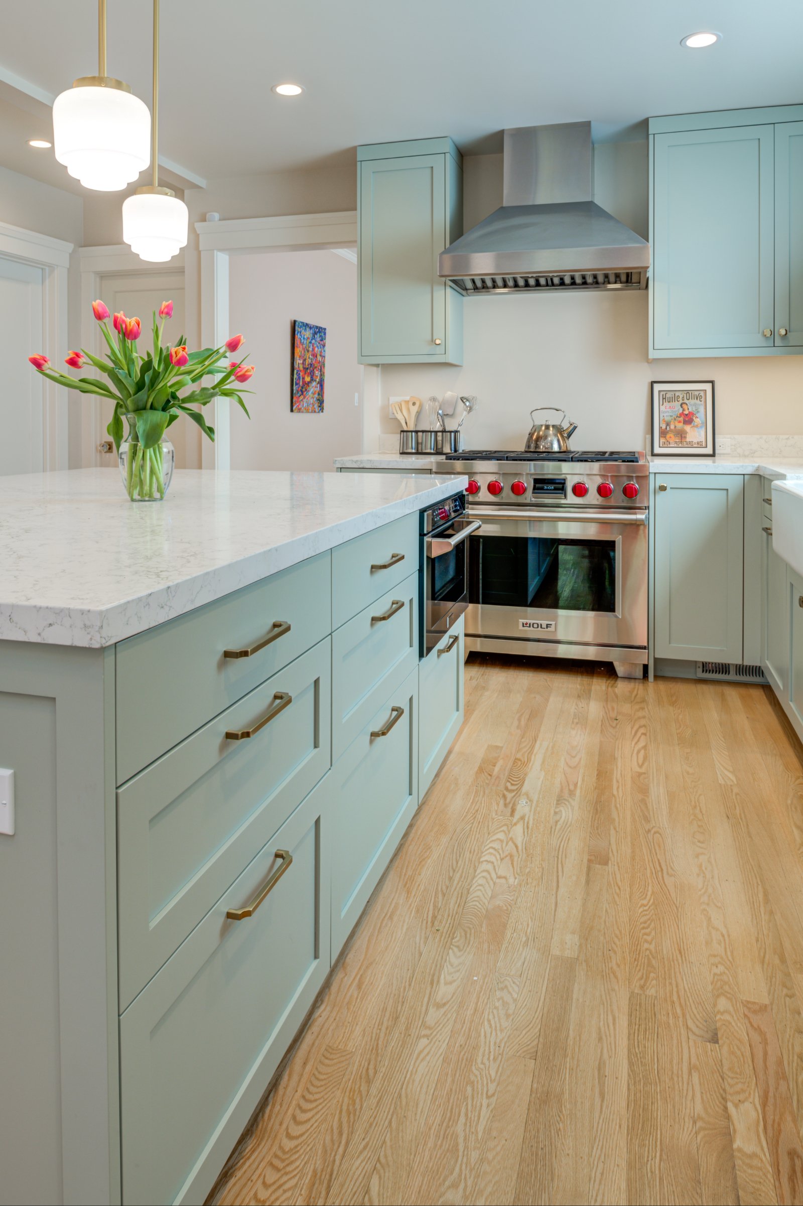 New Kitchen with Levitch-built cabinets and a mix of recessed and pendant light fixtures over the island