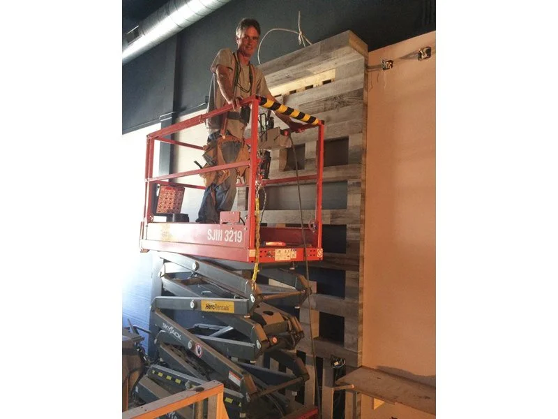 Lift and retail accent wall installation at BIBO Salon