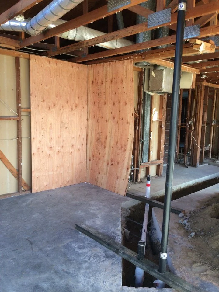 Interior framing during the Alameda remodel showing new wall layout, mechanical runs, and structural upgrades before finishes were installed.