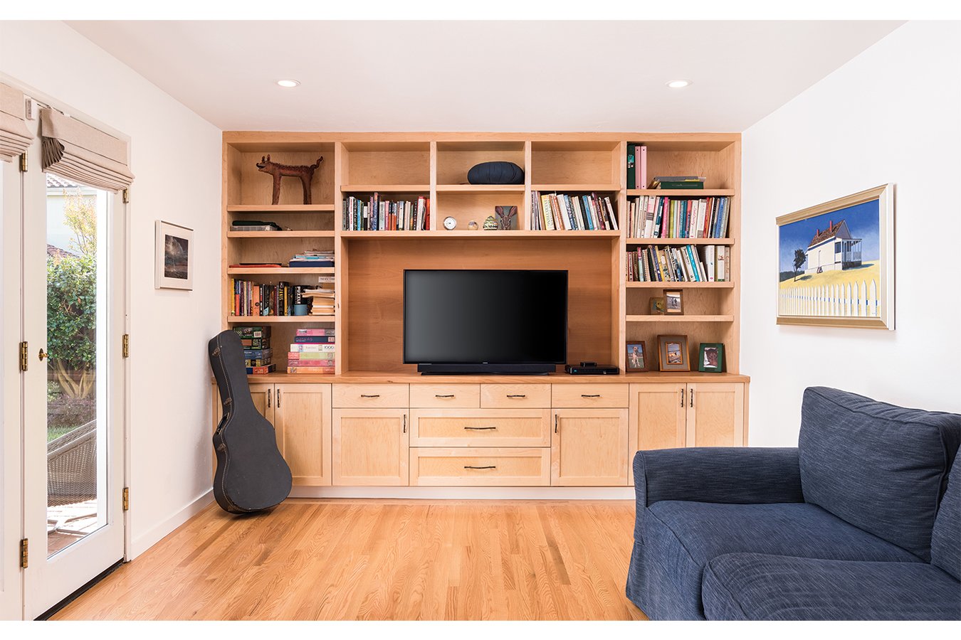 Family room update with custom media cabinetry built-in along wall