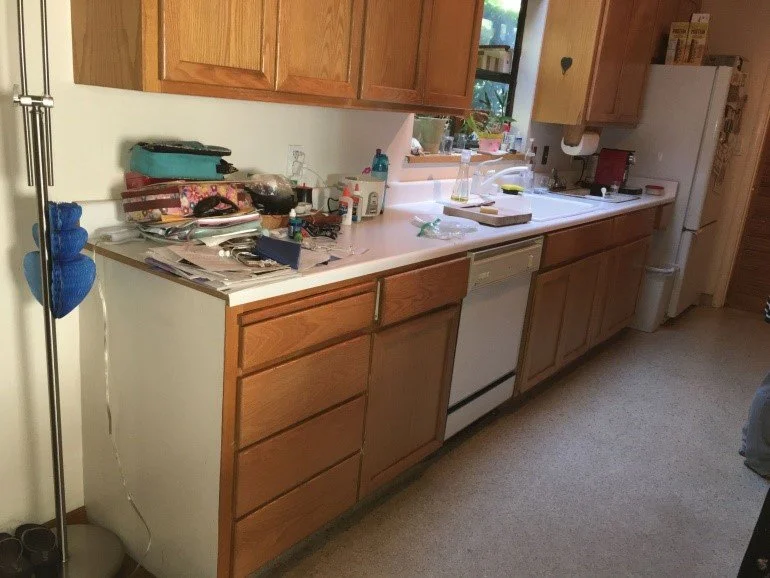 Original kitchen before remodel, showing dated cabinetry, appliances, and limited counter space.