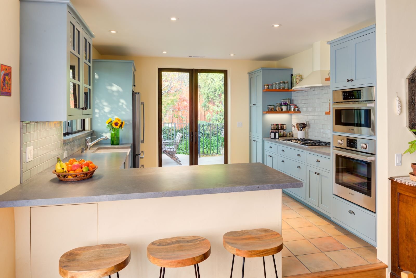 North Kitchen view highlighting barstool seating at the peninsula. Step up to enter the Kitchen.