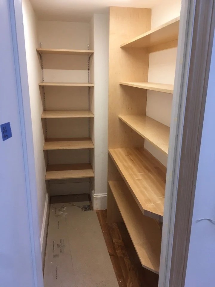 Newly built pantry with custom wood shelving under construction, adding organized storage as part of the Lighthearted Kitchen and Family Room Addition.