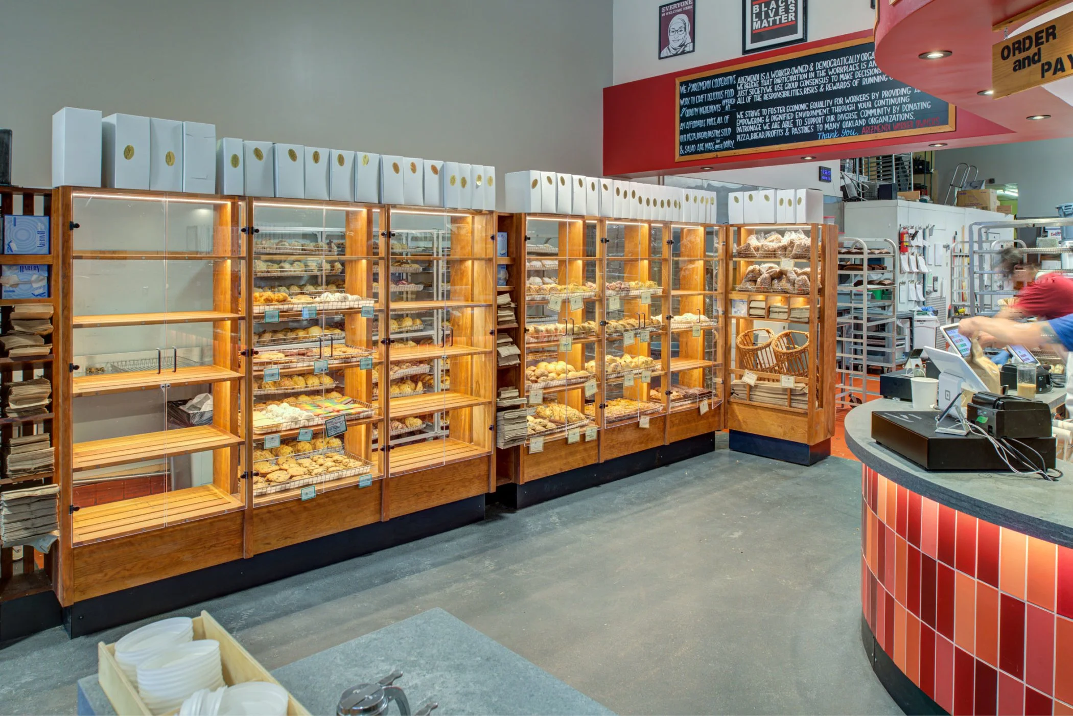 Arizmendi Bakery custom self-serve display cases for baked goods, made of wood with clear acrylic doors.
