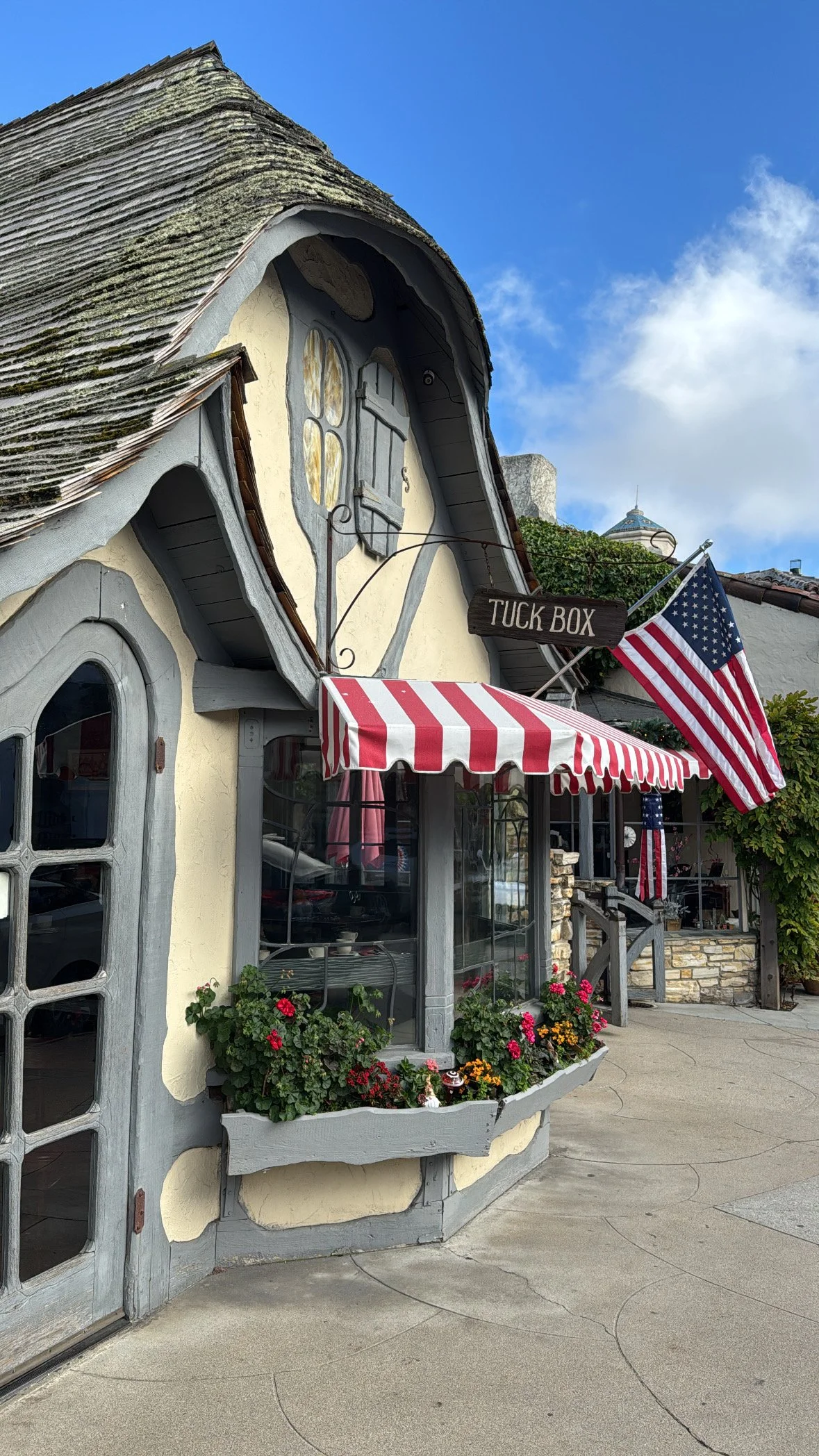 Charming storybook architecture in Carmel-by-the-Sea featuring The Tuck Box restaurant and its distinctive curved roof.