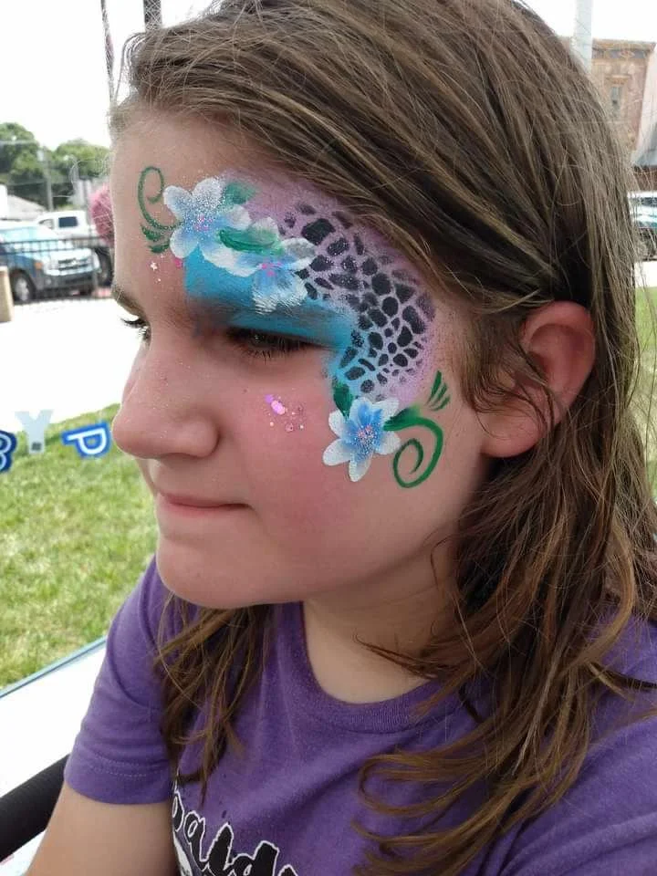 Flowers and cheetah face paint