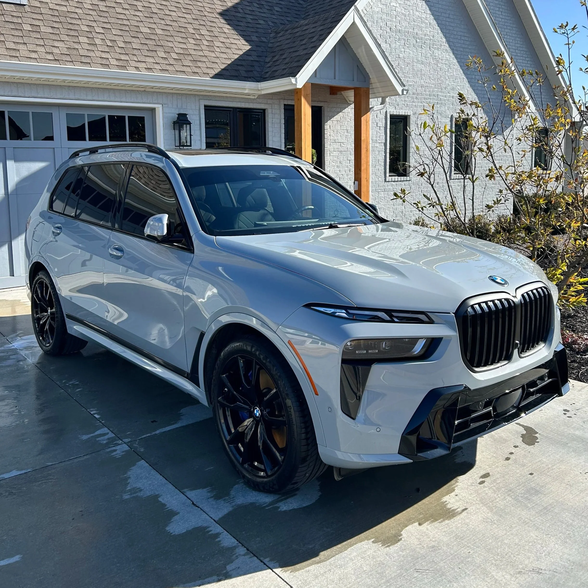 Gray BMW X7 with ceramic coating applied for enhanced gloss and protection