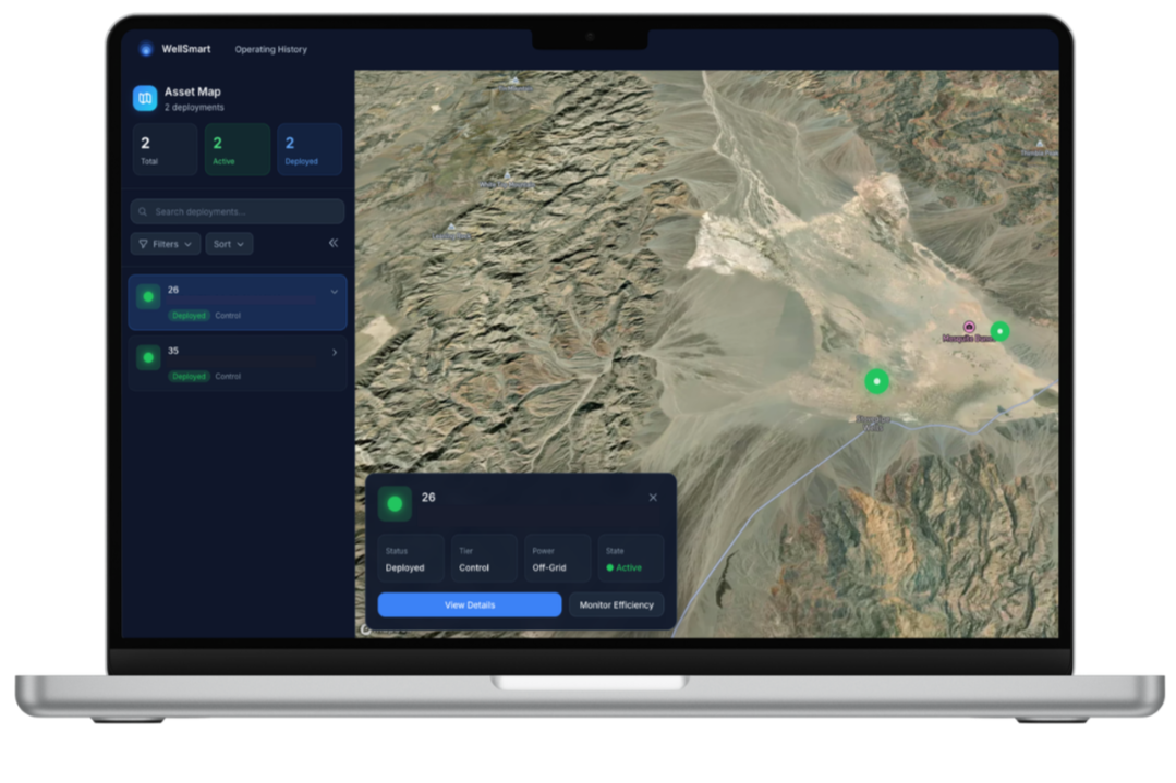 An Apple Laptop sits open with a screen showing an Asset Map with groundwater wells marked on the satellite image map, along with remote data access indicating groundwater well status and availability.