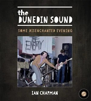 Cover of a book titled 'The Dunedin Sound: Some Disenchanted Evening' by Ian Chapman, featuring a photo of a band performing with a female lead singer on stage.