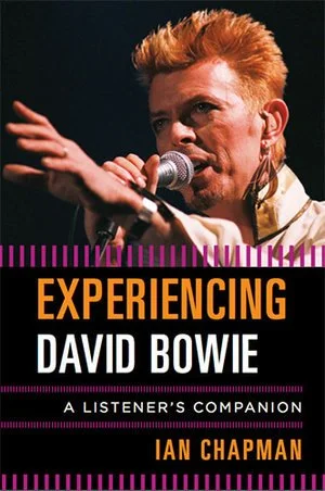 Book cover for "Experiencing David Bowie: A Listener's Companion" by Ian Chapman, featuring a photo of David Bowie with orange hair singing into a microphone.