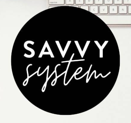 Black circle with the text "SAVVY system" in white, placed over a keyboard.