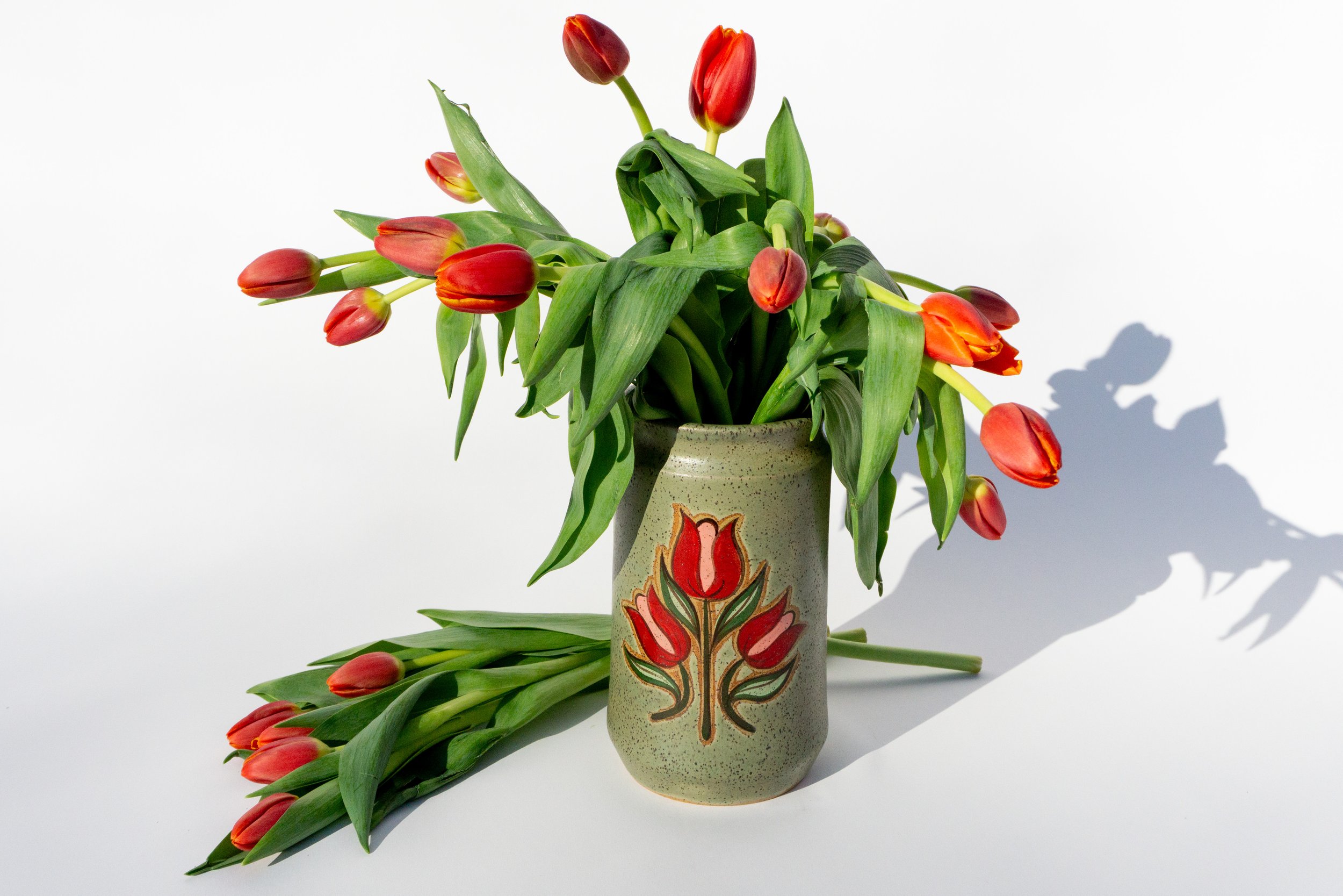 Green Crock with Red Flowers