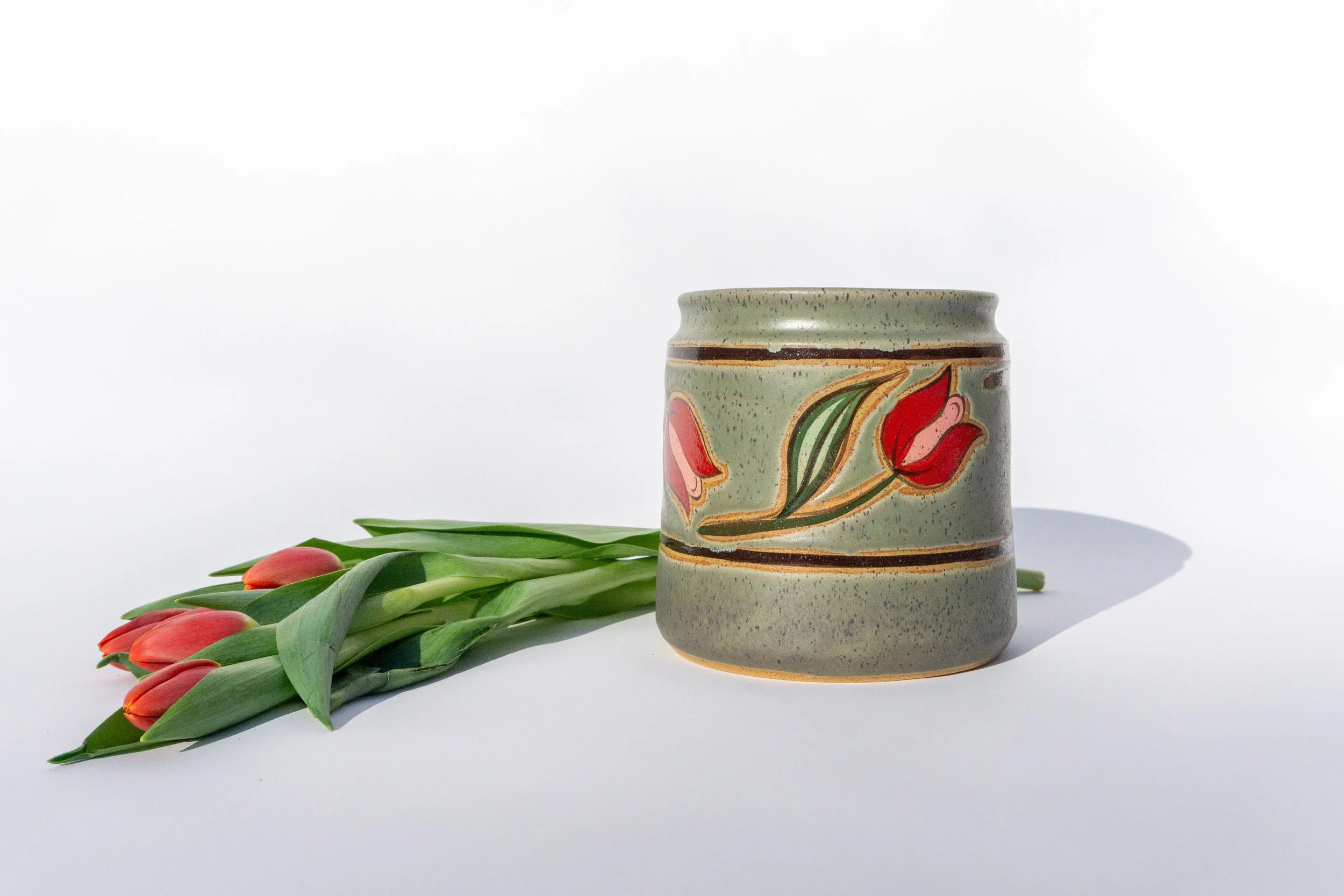 Green Crock with Red Flowers