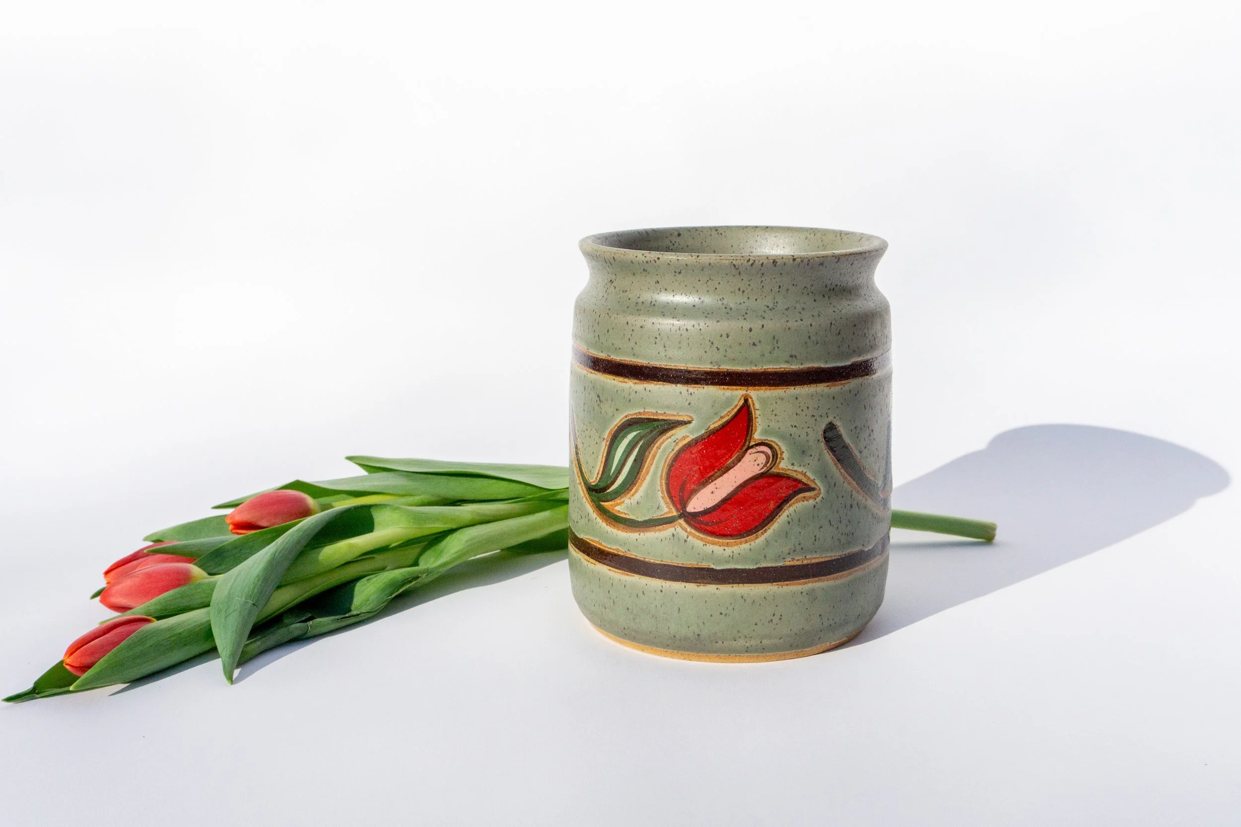 Green Crock with Red Flowers