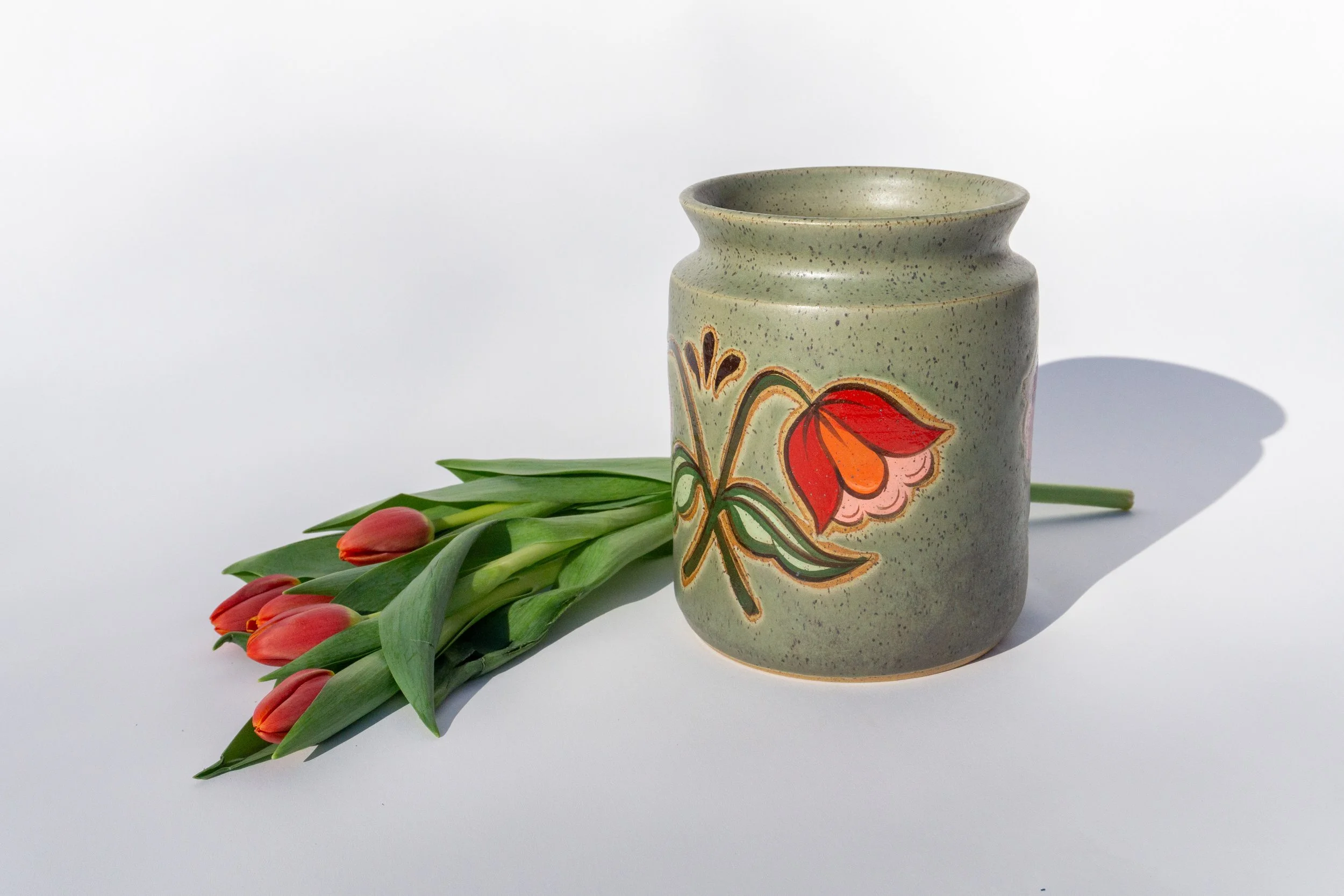 Green Crock with Red Flowers