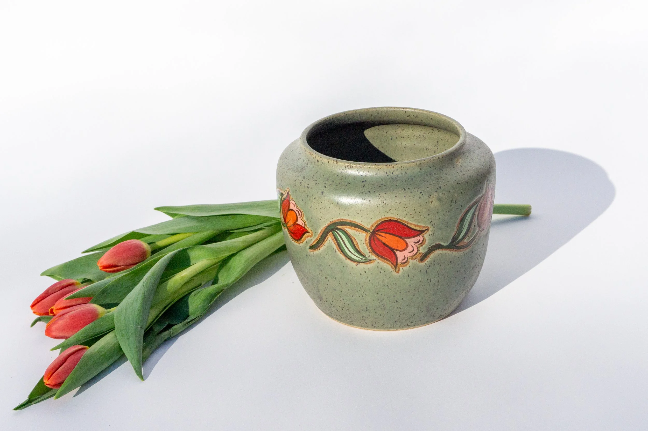 Green Crock with Red Flowers