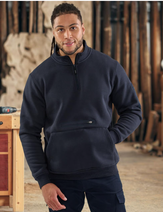 Two restaurant staff members, a woman and a man, standing at the counter in a cafe or restaurant, smiling and engaging with customers.