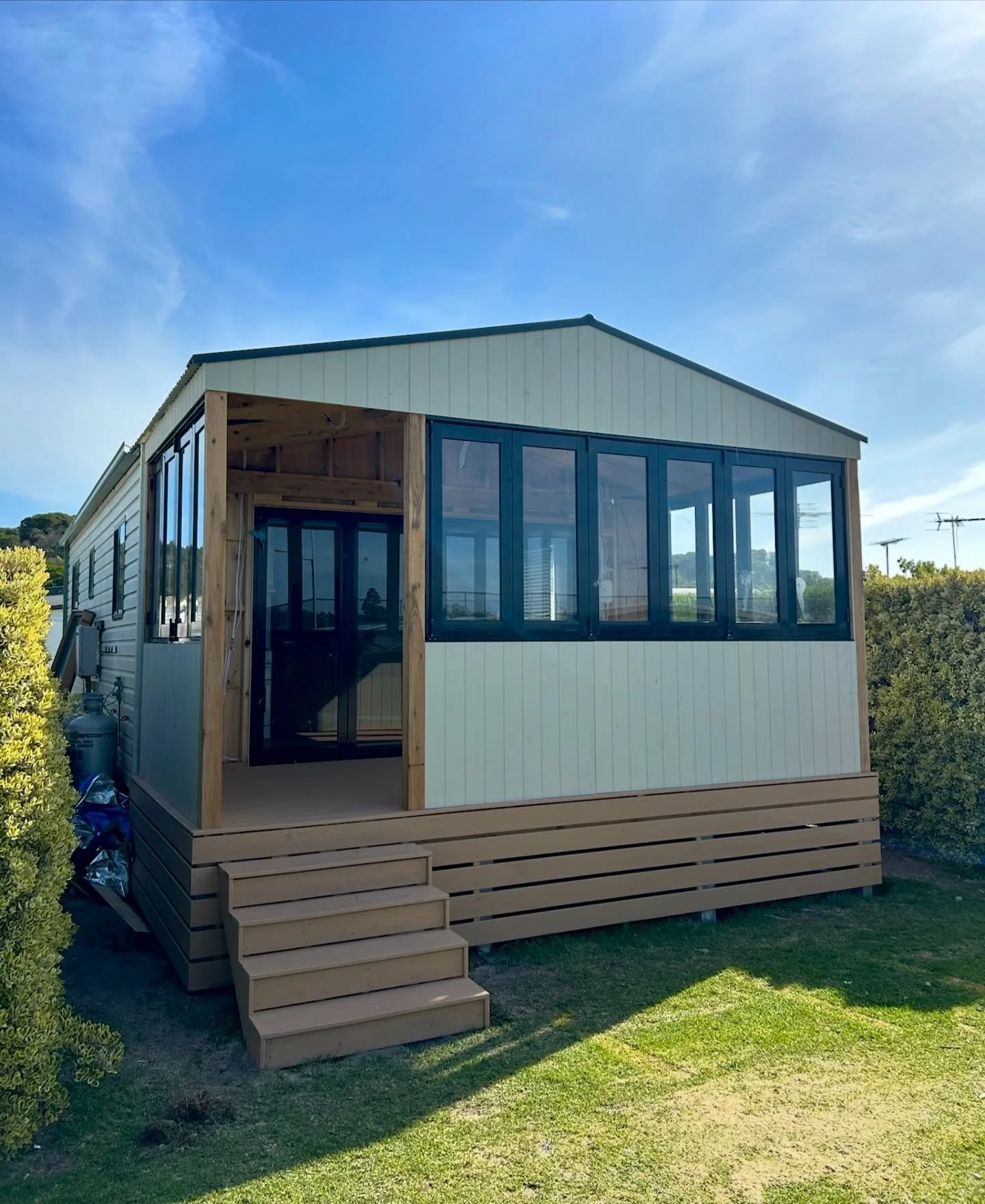 Swipe across the dots to see a coastal cabin upgrade in Ocean Grove!

We extended the living space and introduced bifold windows to maximise natural light and connection to the outdoors. Open them right up to soak in the sunshine, or close the space 