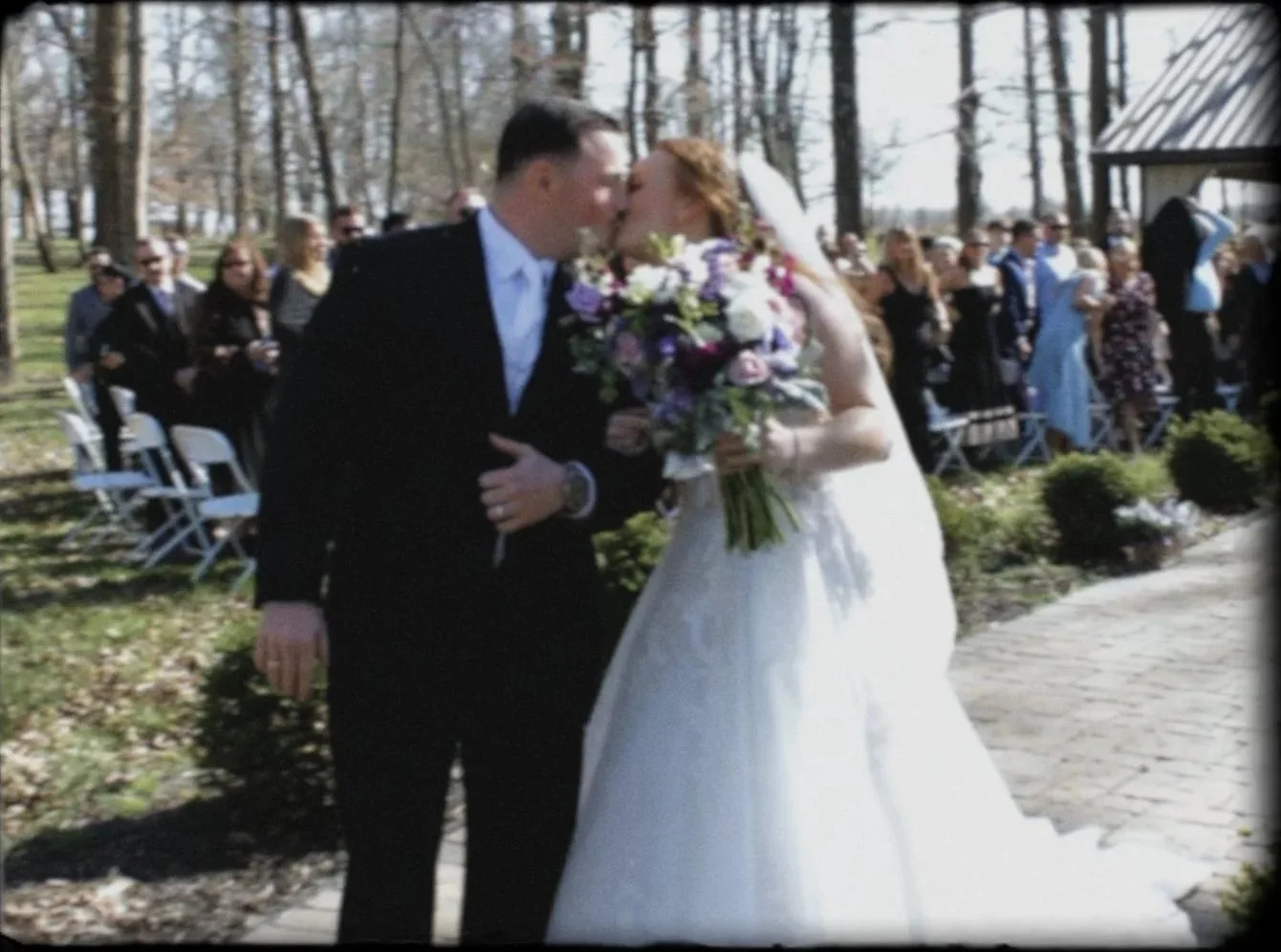 A newly wedded couple sharing a kiss