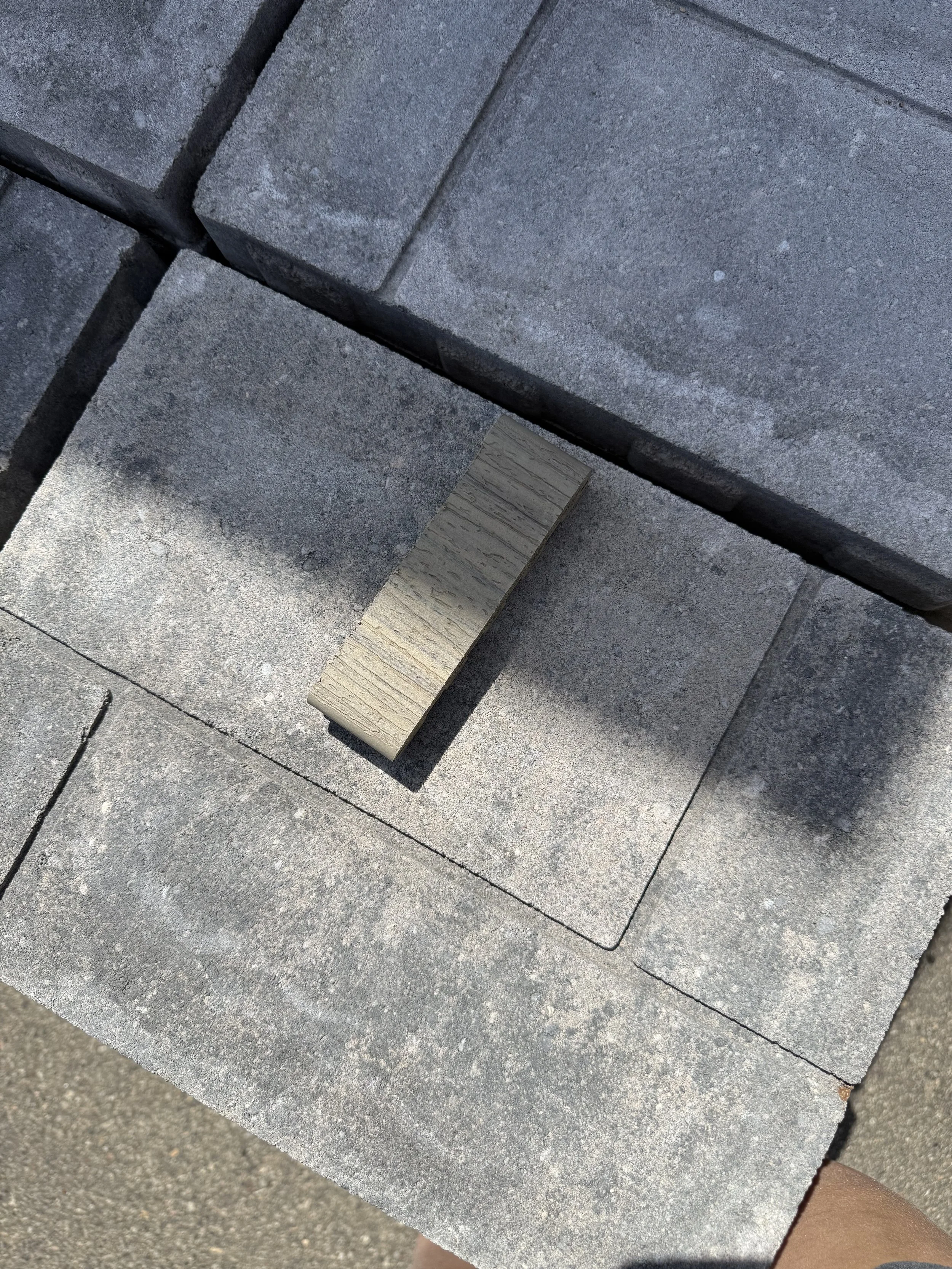 Testing the pavers with decking color before purchasing!