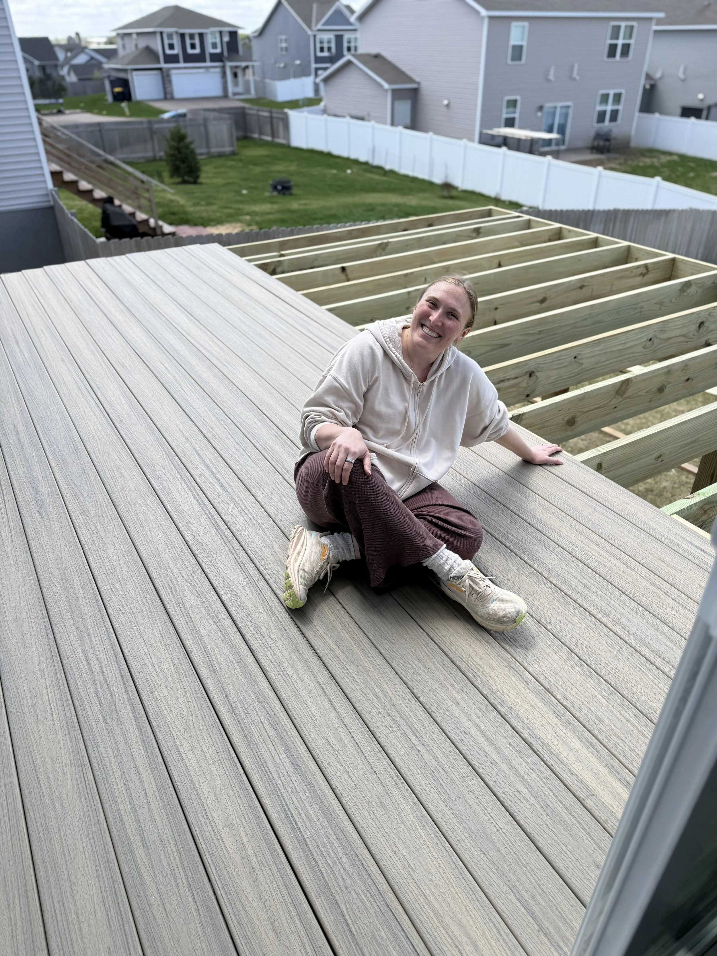 Homeowner helping to lay her decking!