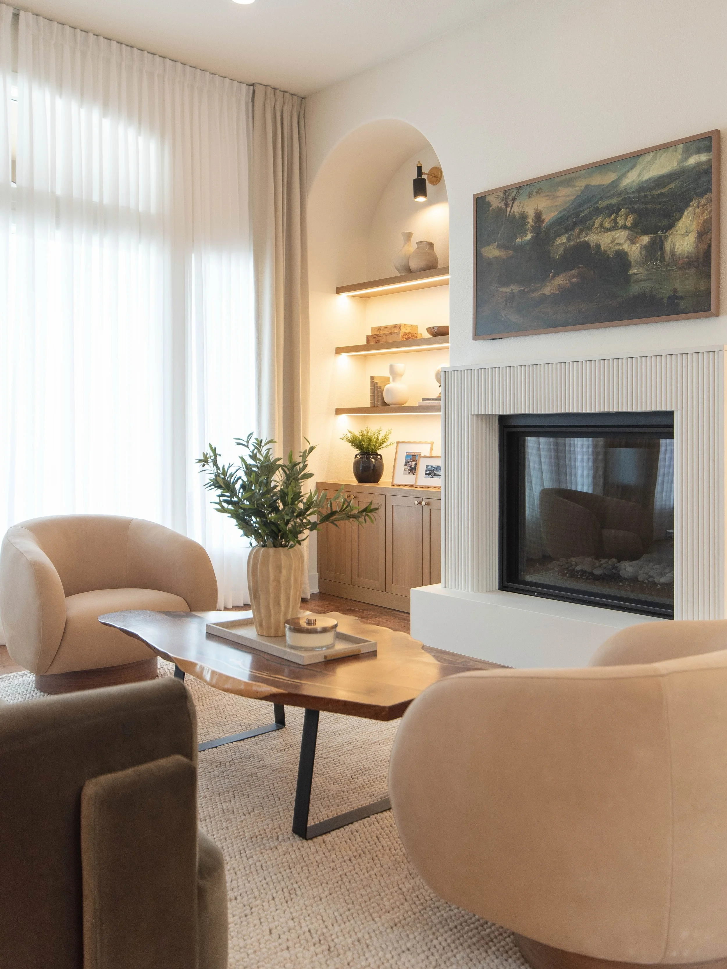 A dated fireplace/built ins and heavy drapery give way to fluted plaster, warm oak built-ins, and a softer, more livable palette. The full Bayswater living room remodel from the ground up.

Designed by | @kristin.theidearoom &amp; @jillian.theidearoo