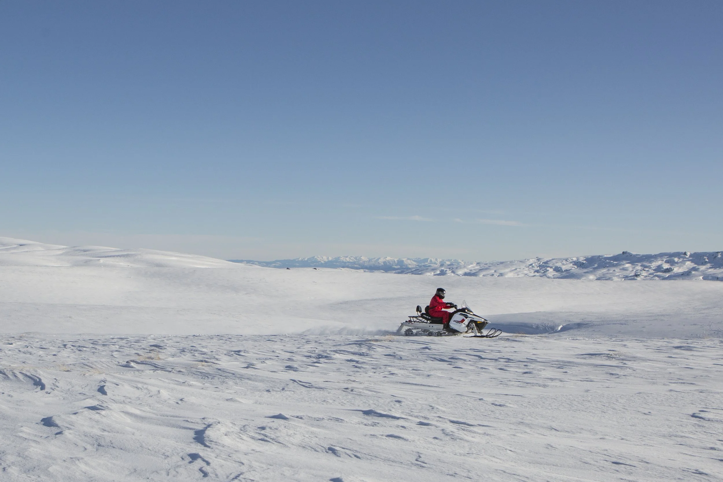 Queenstown_Snowmobiles_single snowmoblier on plateau.jpg