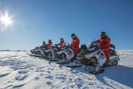 Queenstown Snowmobiles Group of six in row.jpg