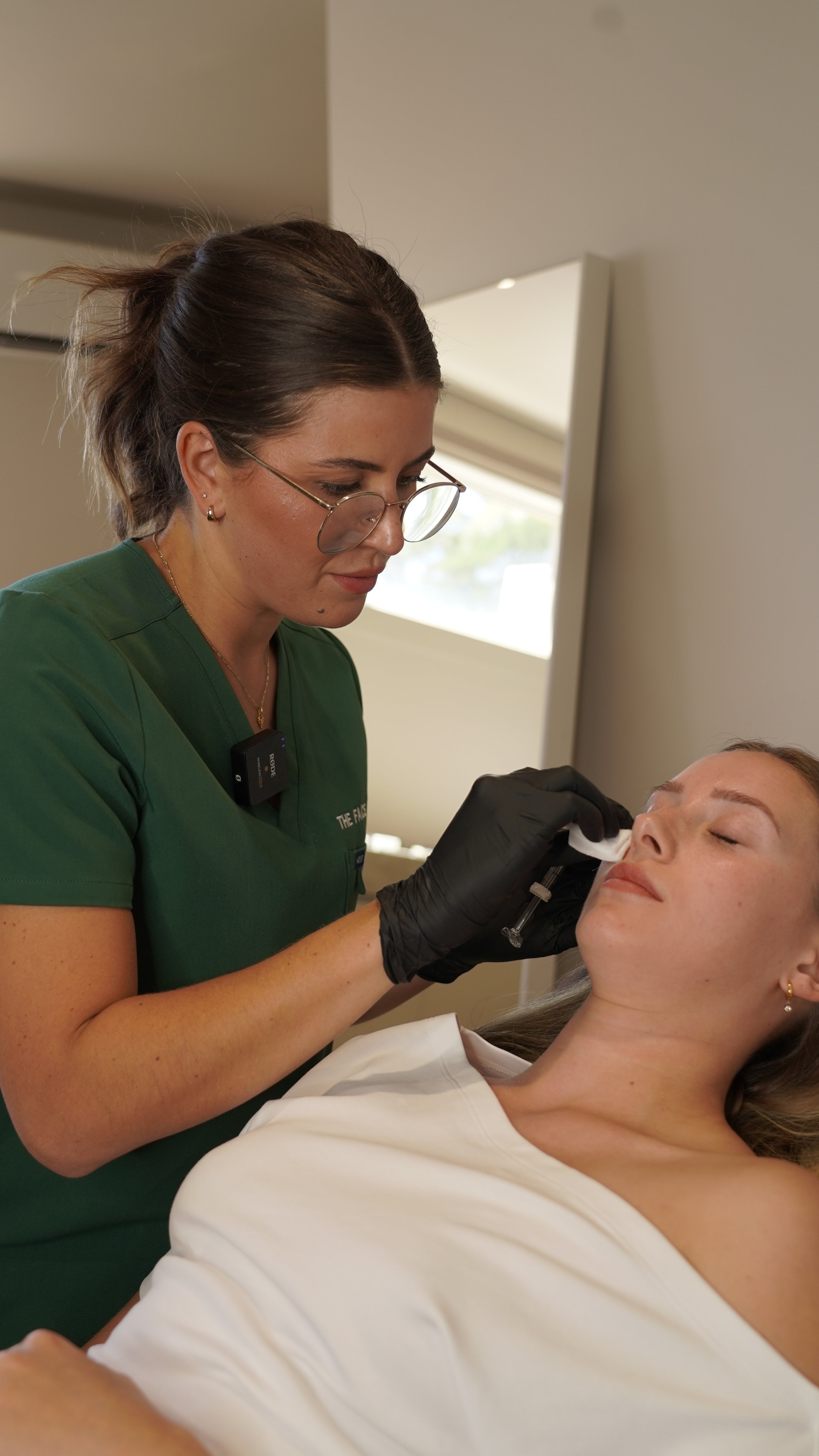Registered cosmetic nurse Kanisha administering Rejuran skin rejuvenation treatment to a patient at The Face Clinic in Melbourne, enhancing skin hydration and texture through advanced cosmetic nursing care.