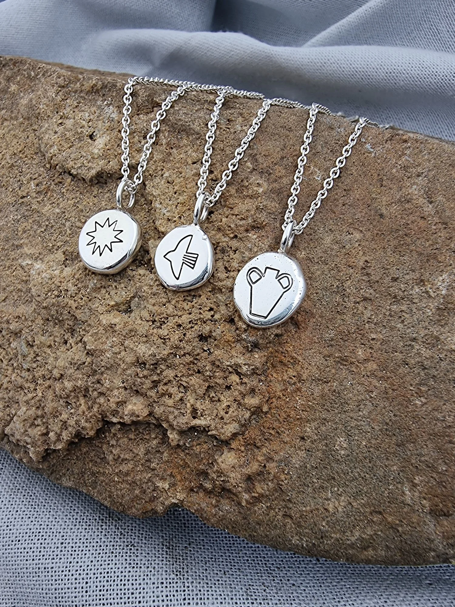 RADIANCE – Recycled stamped silver pendants