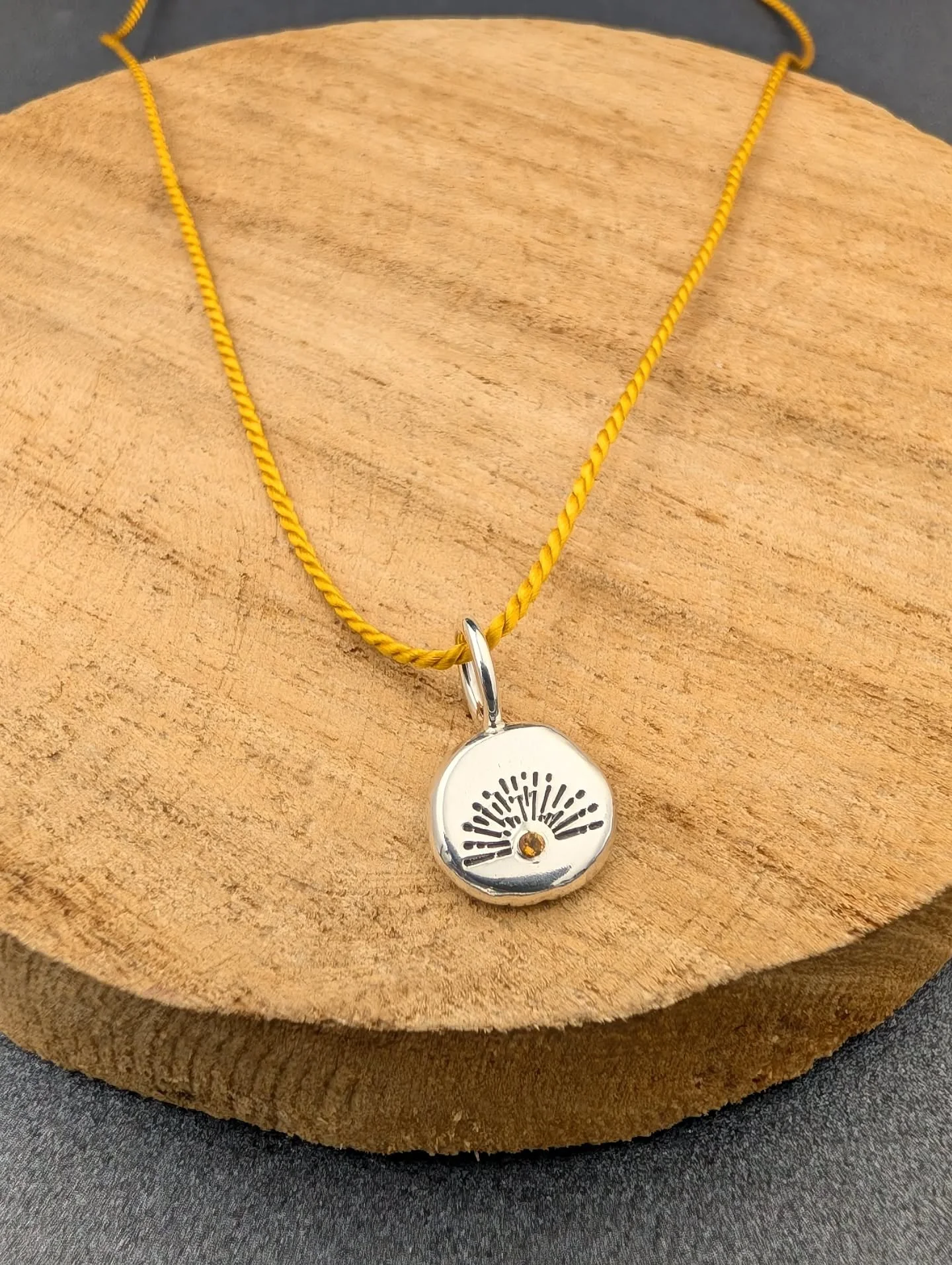 ☀️ THE SUN WILL COME OUT TOMORROW ☀️ now I'm singing the song from Annie.

I'll be adding a new batch of designs to my online shop tomorrow including this sunny necklace.

☀️ Recycled silver

☀️ One off design

☀️ Silk thread