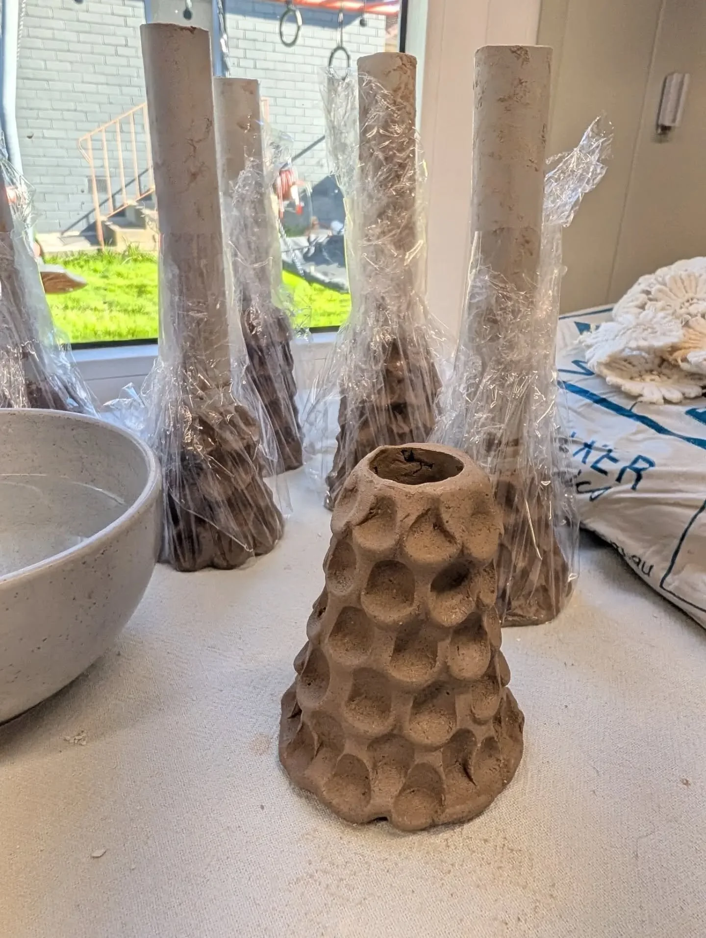 ORGANIC CLAY FORMS - these textured clay candle stick holders or dried flower vessels are currently drying in the studio. 

Textured with my index finger, utilising PVC pipe for the opening. 

I look forward to seeing how these fire 🔥